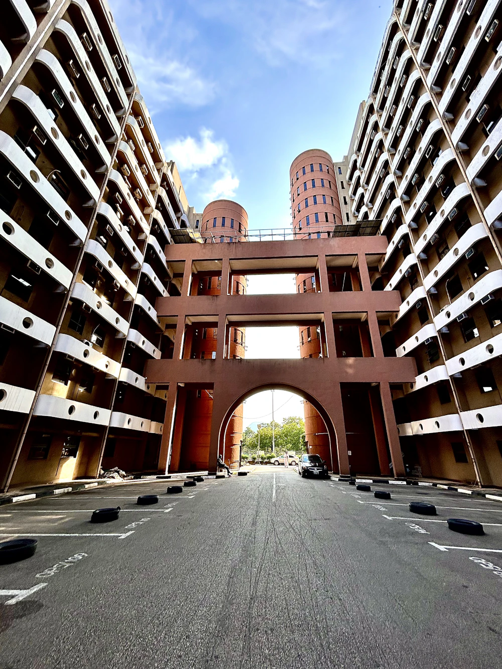 Arched gateway between tall residential blocks