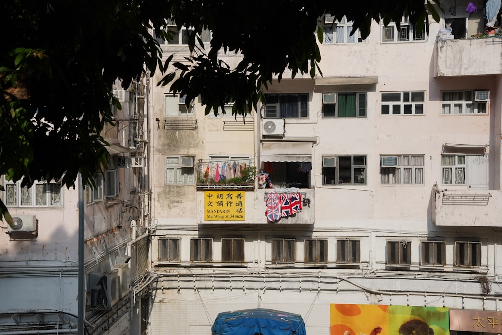 an apartment building with a lot of windows and balconies