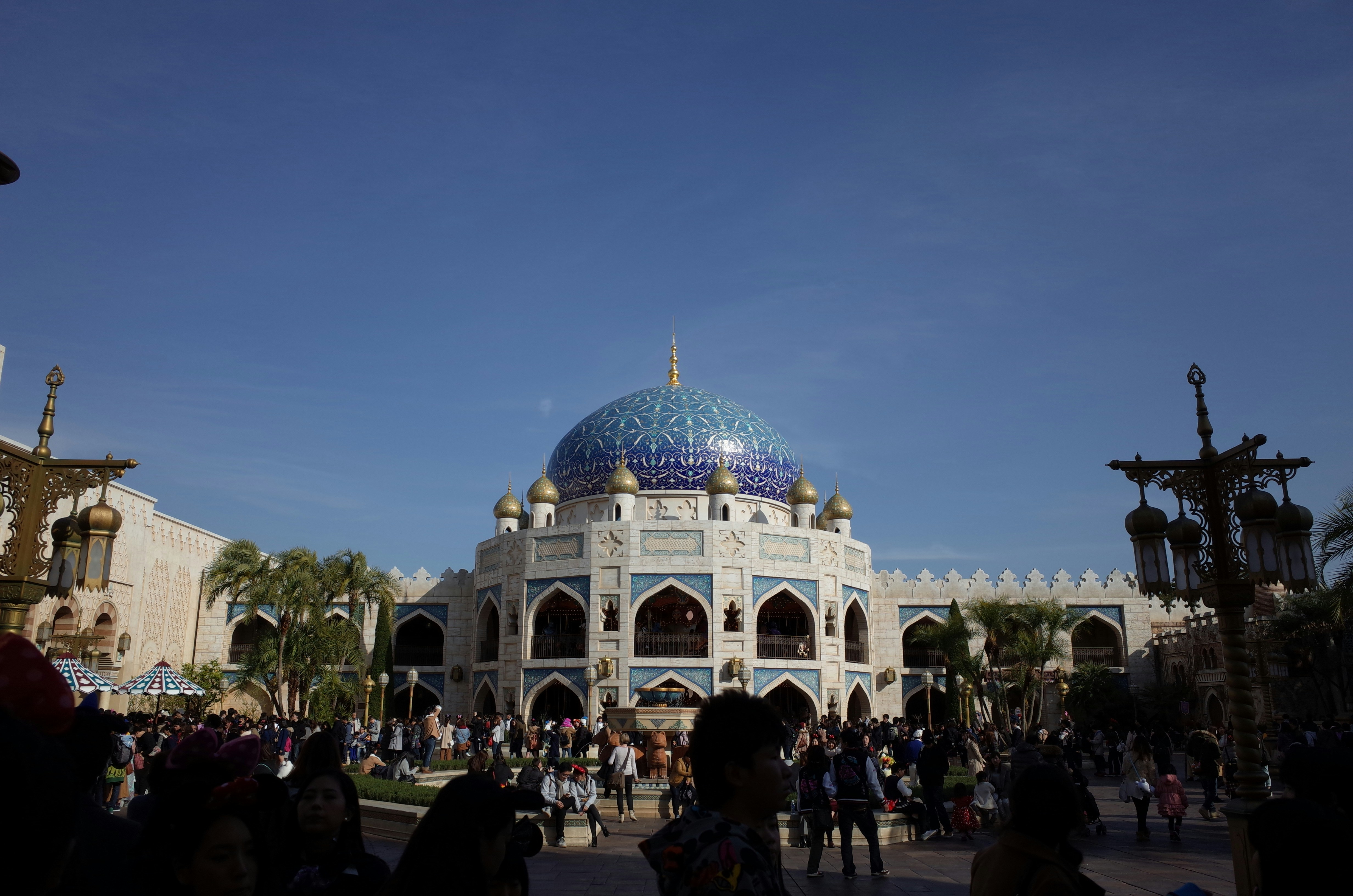 a group of people standing around a building