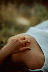 A comforting hand on a stomach, illustrating care for digestive health.