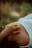 Close-up of a person holding their stomach, symbolizing relief from digestive discomfort.