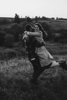 Vintage film still showing a joyful couple performing a classic lindy hop aerial move.