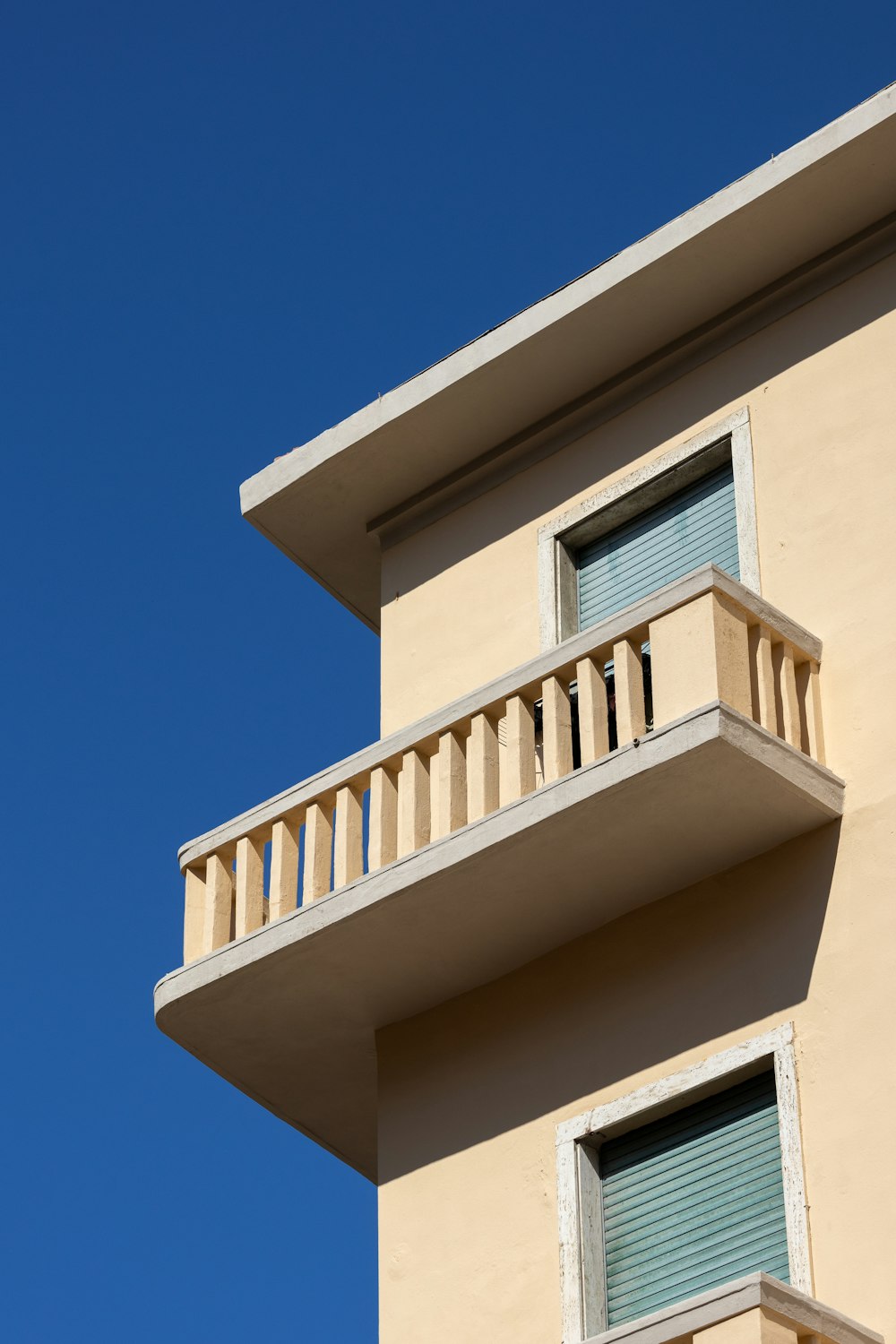 a tall building with balconies and a balcony