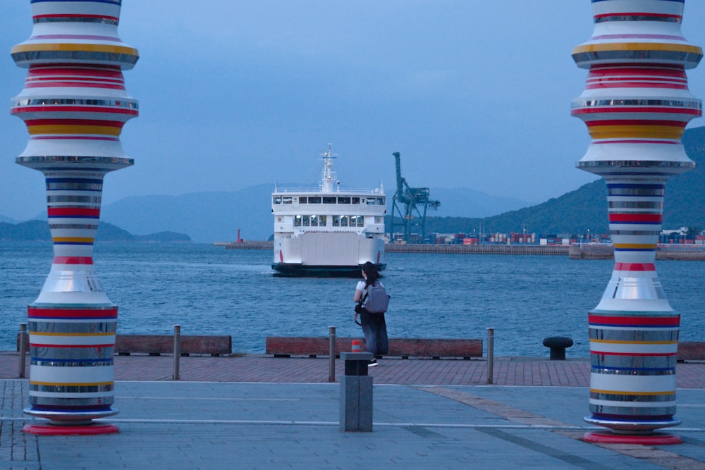 a person standing in front of a body of water