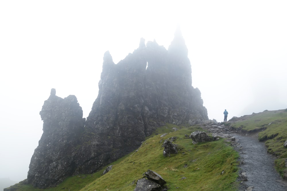 a person standing at the top of a mountain