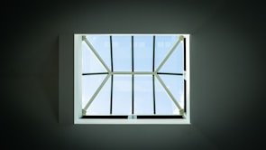 The same skylight after professional cleaning, gleaming with clear glass and no residue.