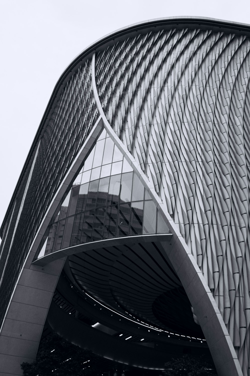 a very tall building with a curved roof