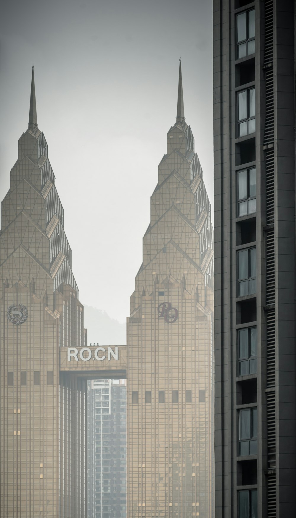 a very tall building with a very tall clock on it's side