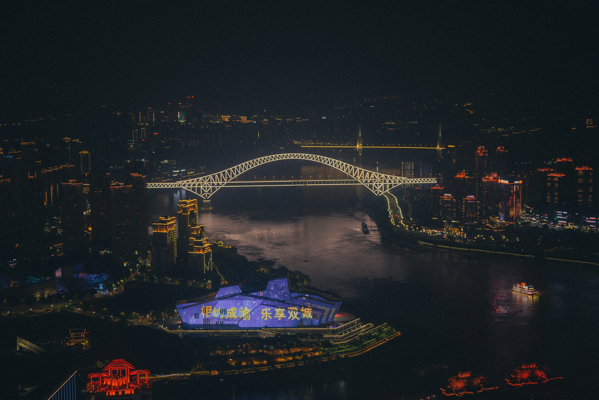 an aerial view of a city at night