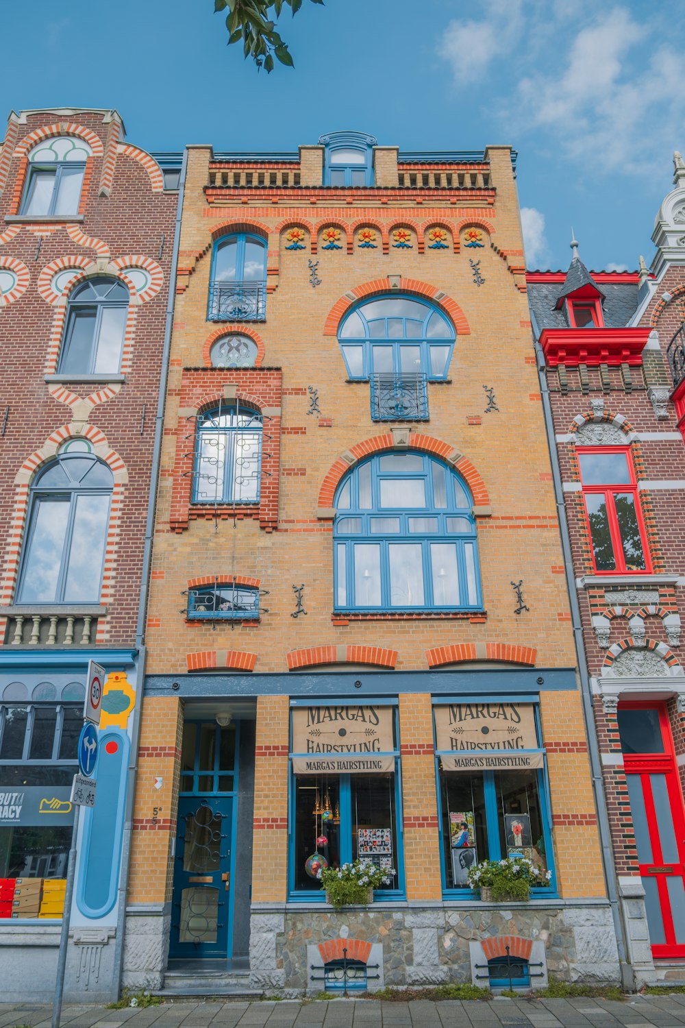 a tall brick building with many windows