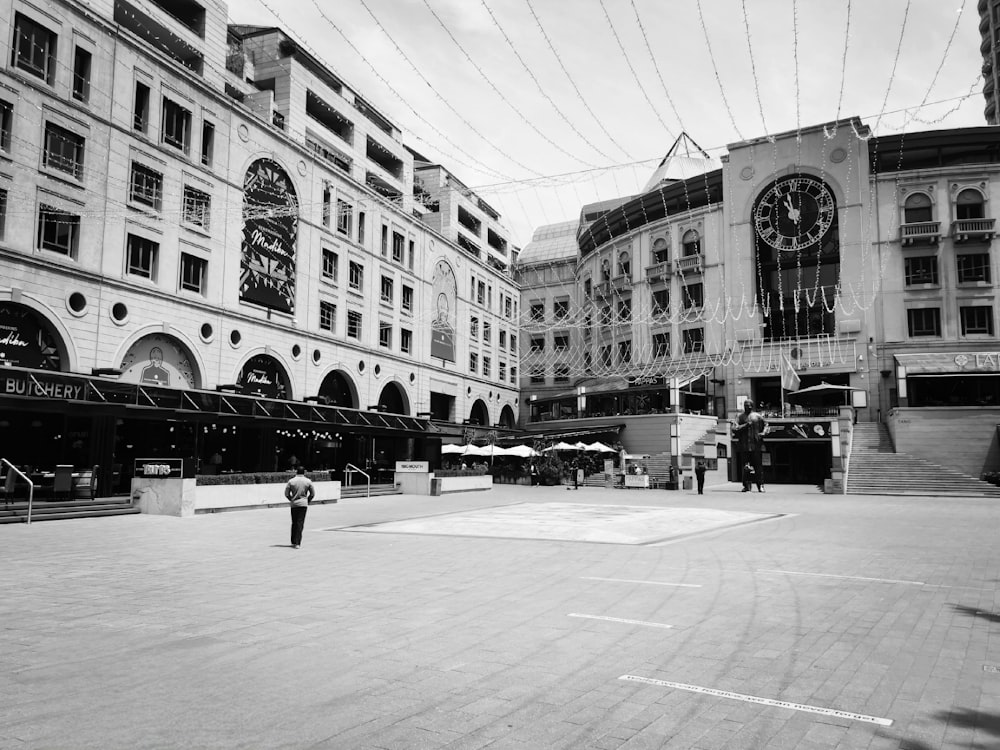 a black and white photo of a city square