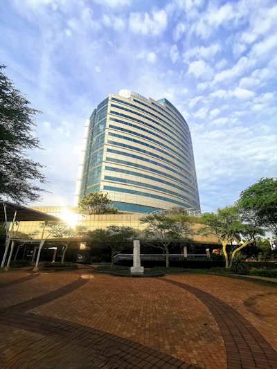 Finished steel frame building used as a modern office space surrounded by greenery.