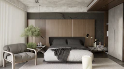 a bedroom with a bed and a chair