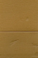 Close-up of a textured cardboard box with a subtle logo embossed.
