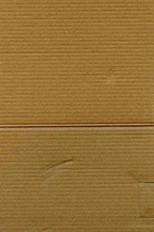 Close-up image showing detailed texture of corrugated cardboard sheets.