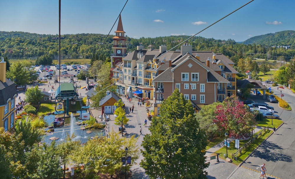 an aerial view of a town with a ski lift