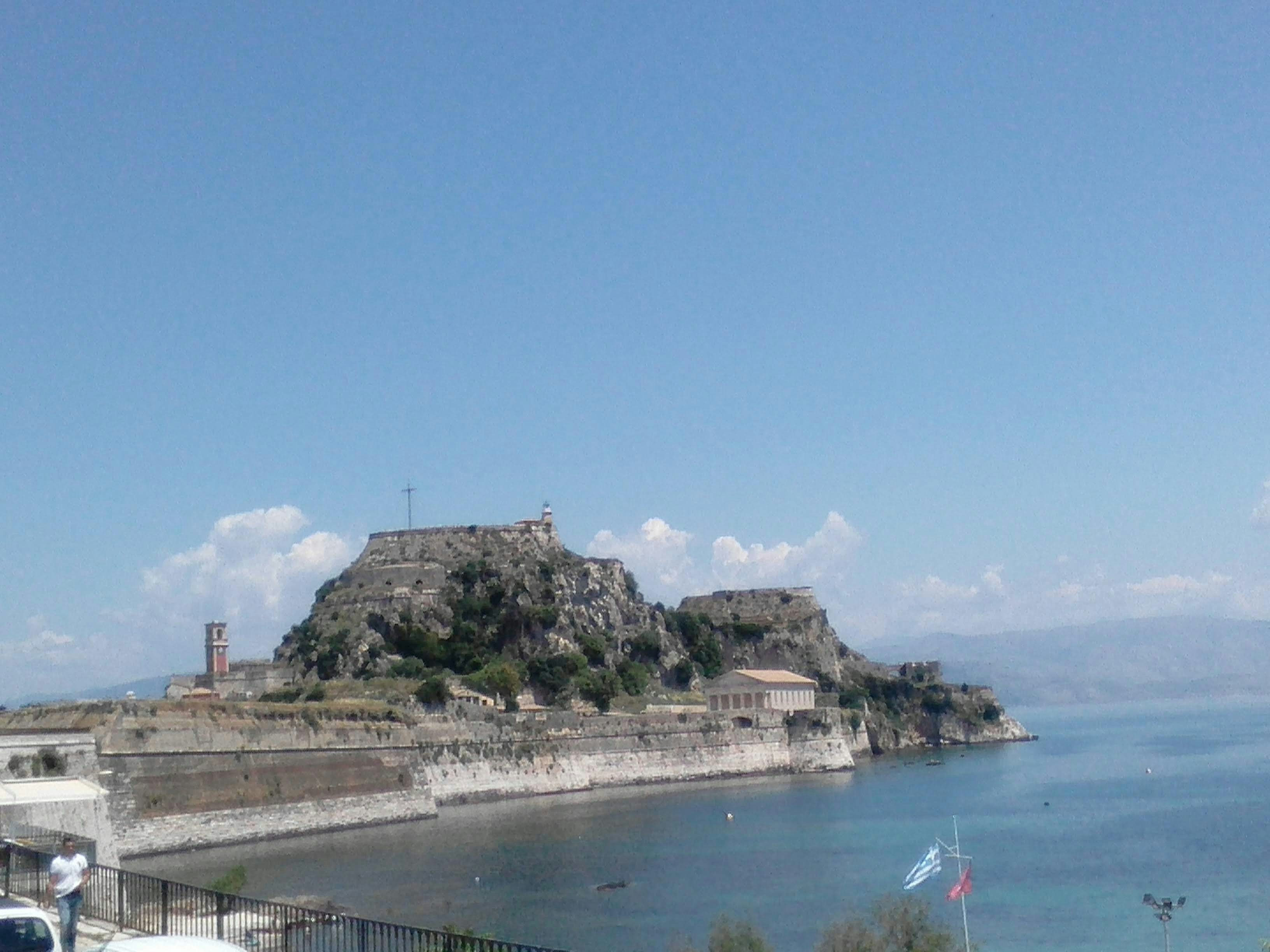 a view of an island in the middle of the ocean, 