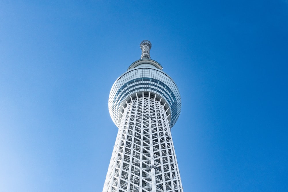 a tall white tower with a sky background