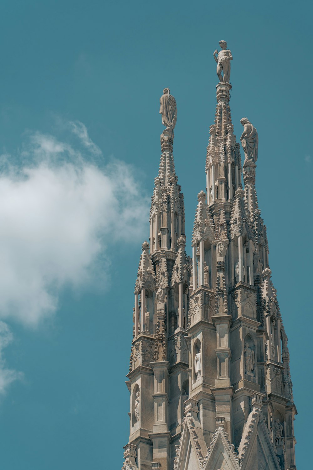 a very tall building with a clock on it's side