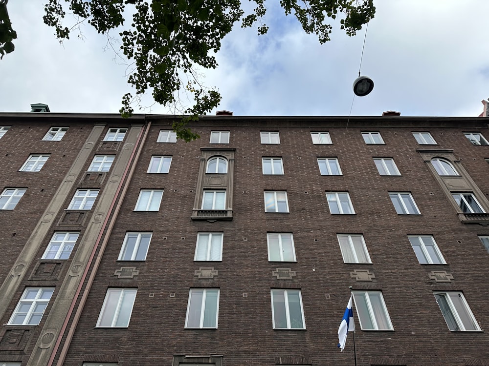 a tall brick building with lots of windows