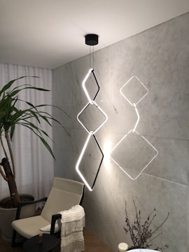 A stylish room illuminated by sleek, contemporary lighting fixtures.