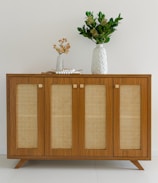 A beautifully arranged rattan sideboard showcasing exquisite jewelry.
