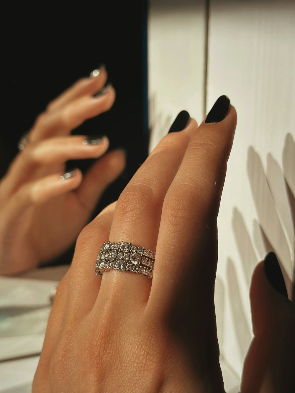 a woman's hand with a ring on it