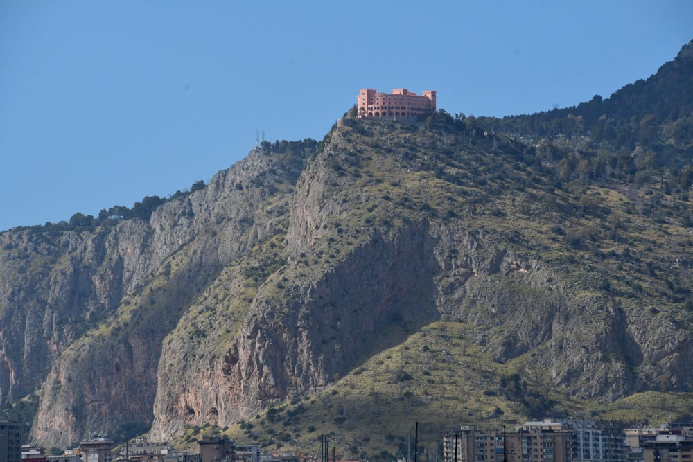 a very tall hill with a castle on top of it