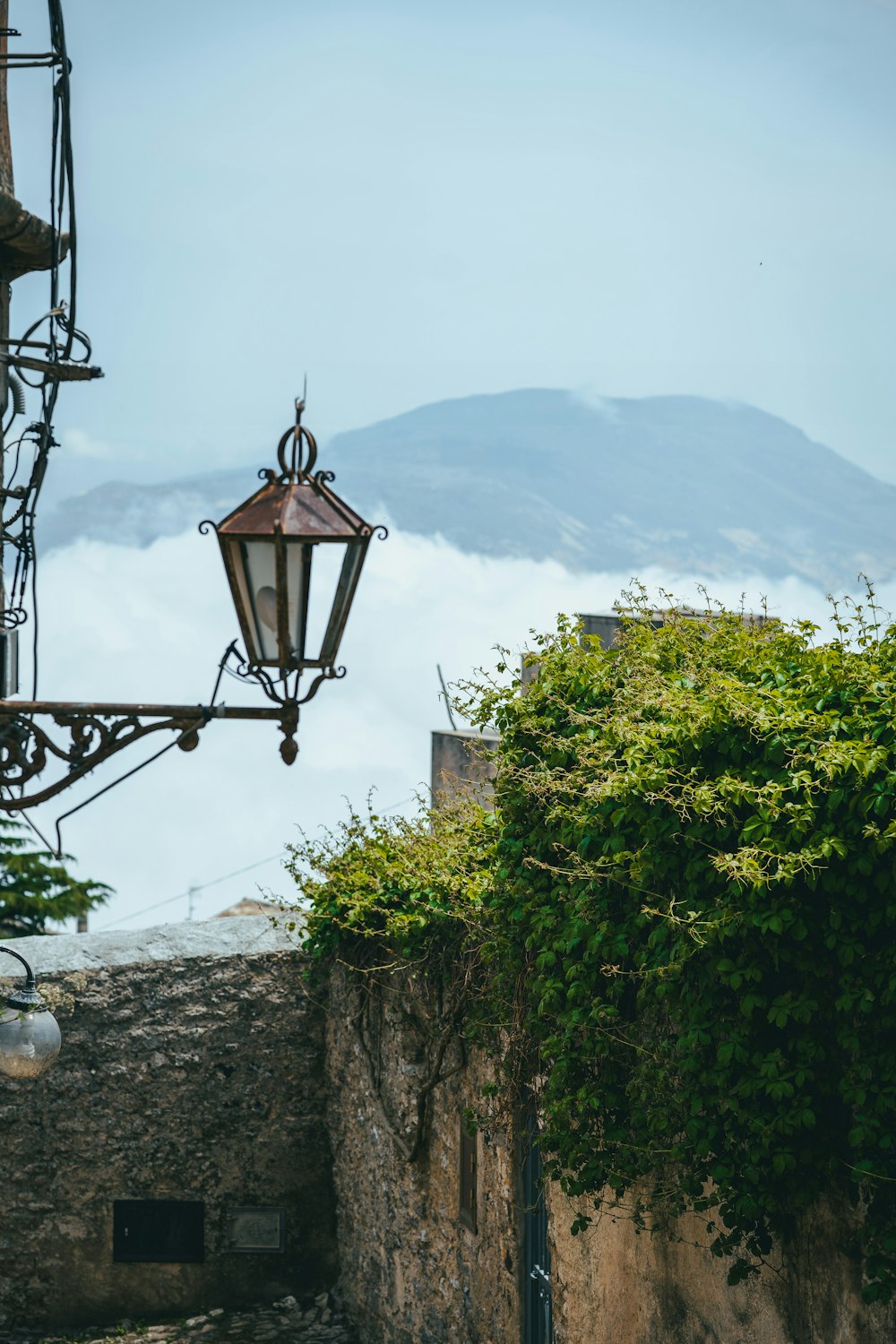 a street light hanging from the side of a building