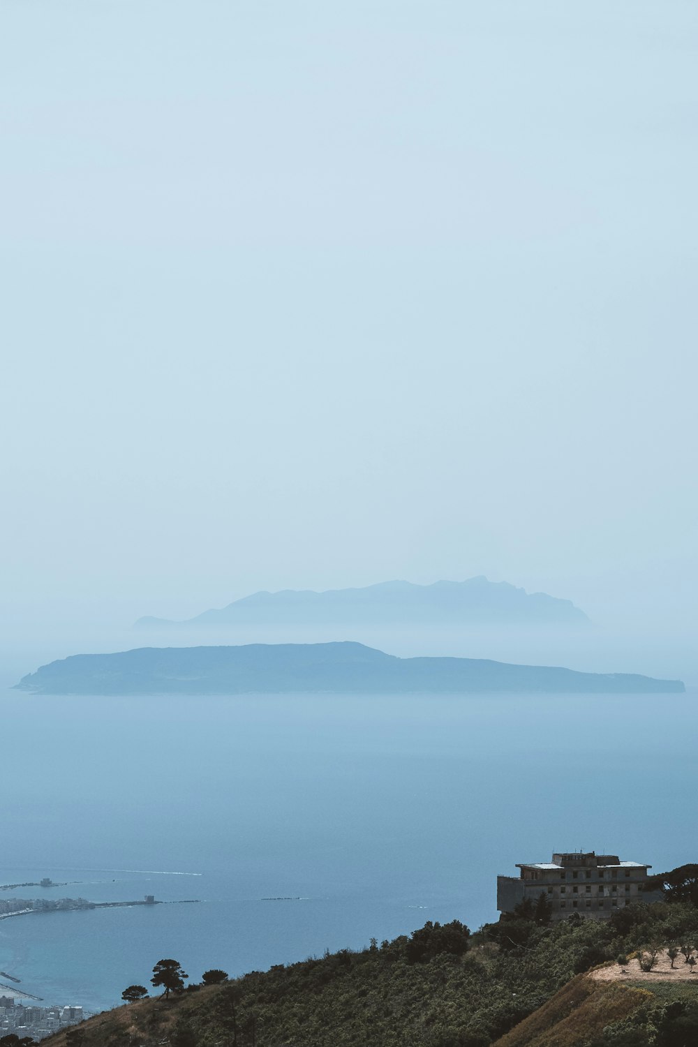 a large body of water with a small island in the distance