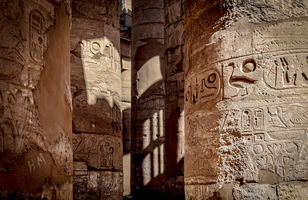 a couple of stone pillars sitting next to each other