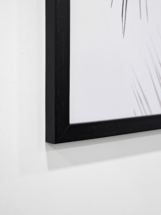 Close-up of a deckled edge artwork beautifully floated in a custom archival frame.