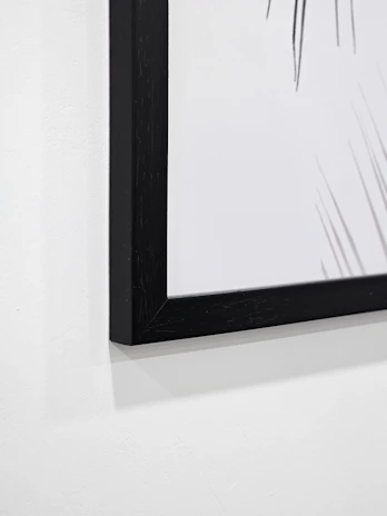 Close-up of a beautifully designed digital art print displayed on a clean white wall.