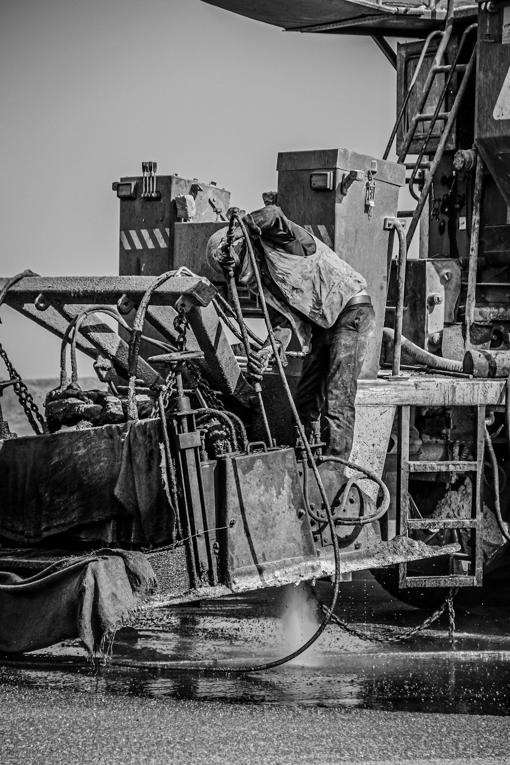 a black and white photo of a large truck