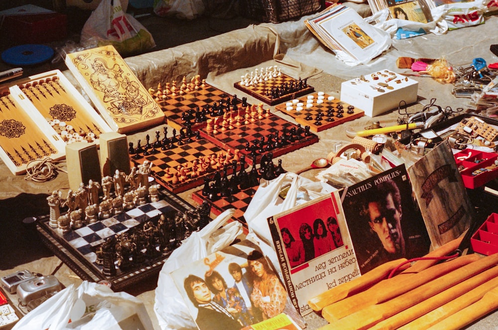 a table topped with lots of chess pieces