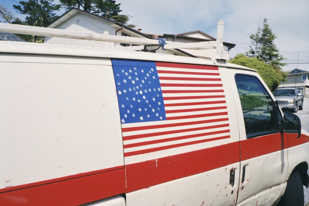 an american flag painted on the side of a van