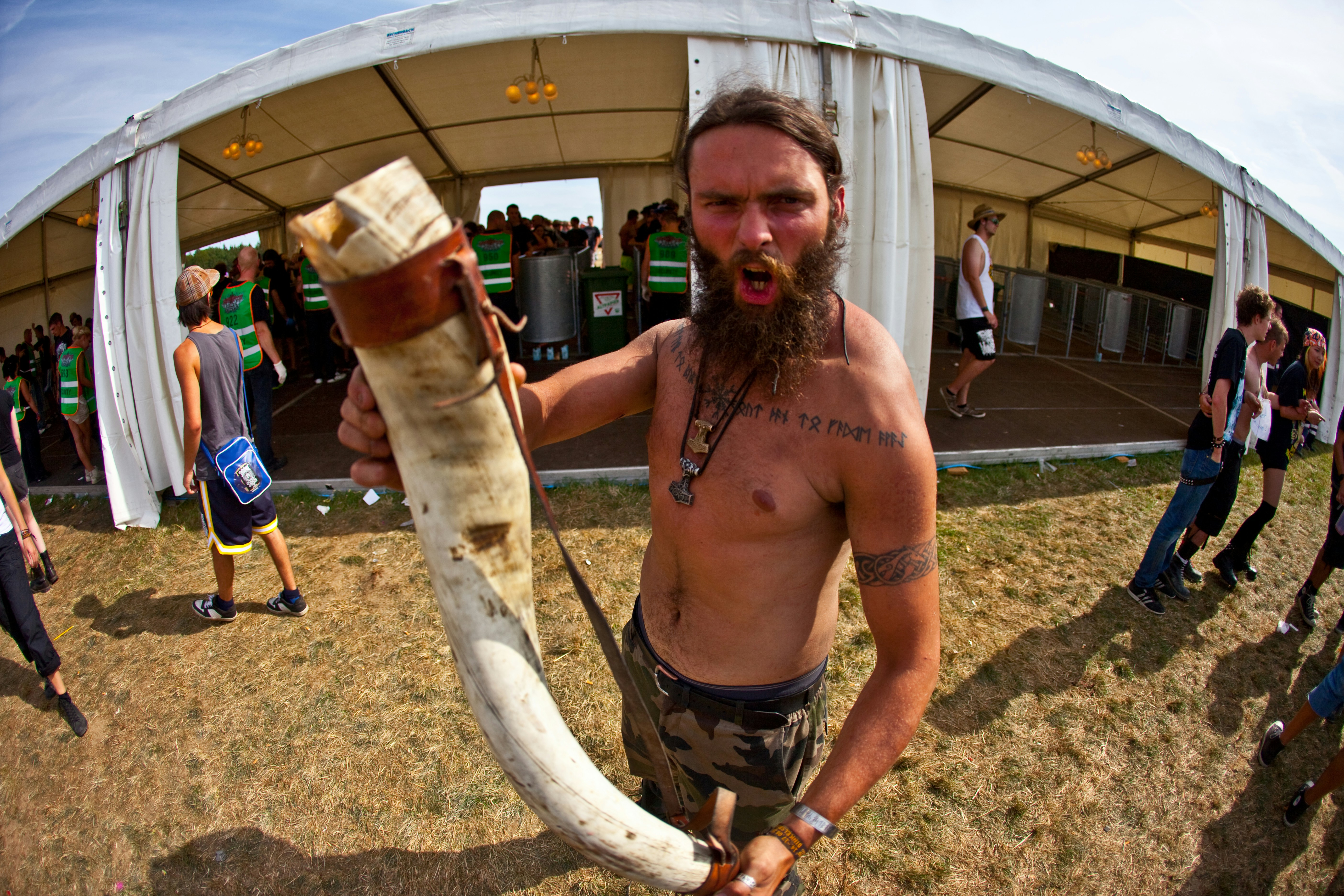 a man holding a large piece of meat in his hand