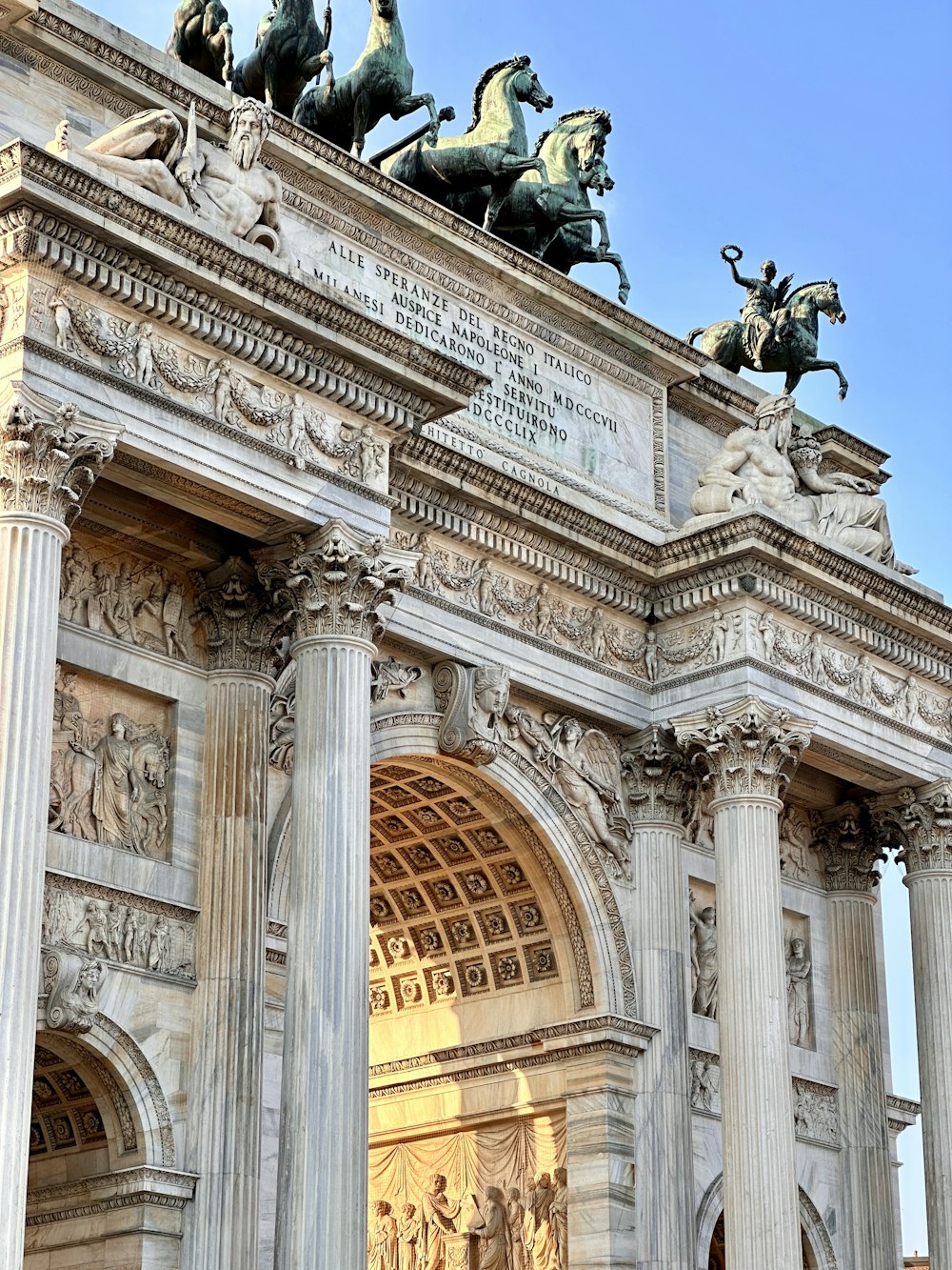 a large building with statues on top of it