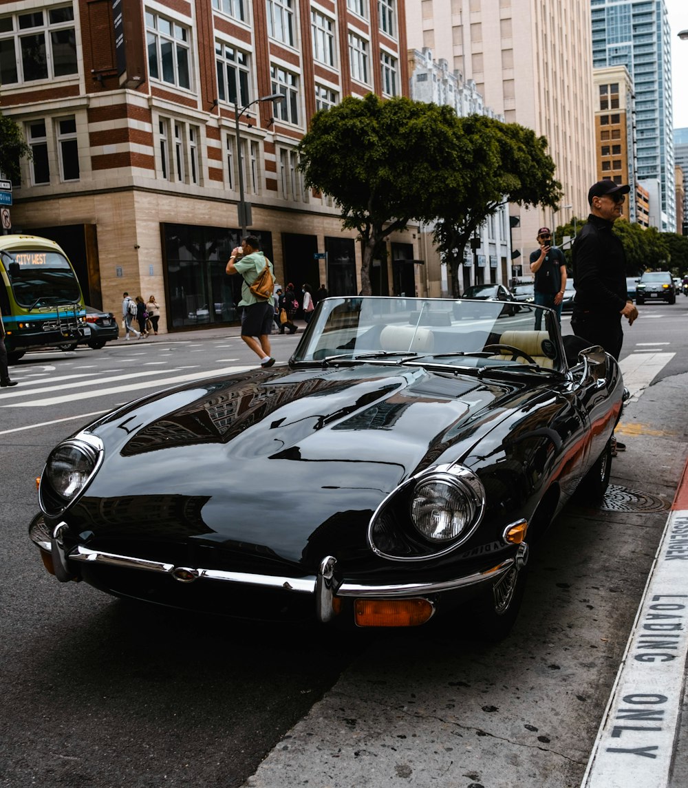 a black sports car parked on the side of the road