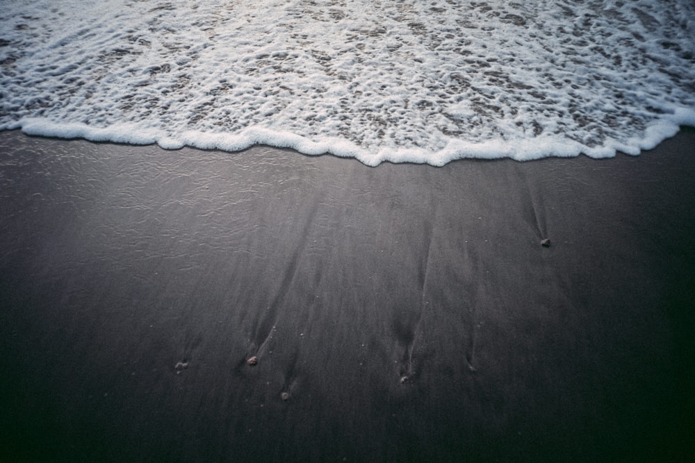 two footprints in the sand on a beach