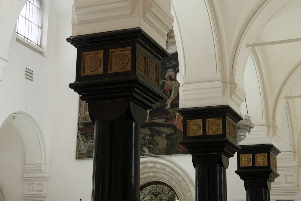 a tall clock sitting inside of a church