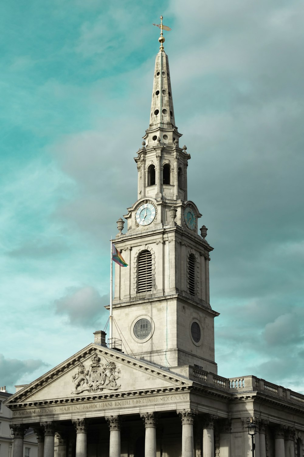 a tall building with a clock on the top of it