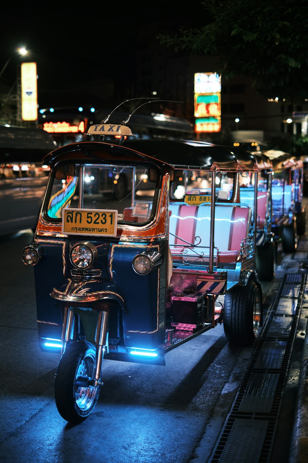 a motorcycle with a cart attached to the back of it