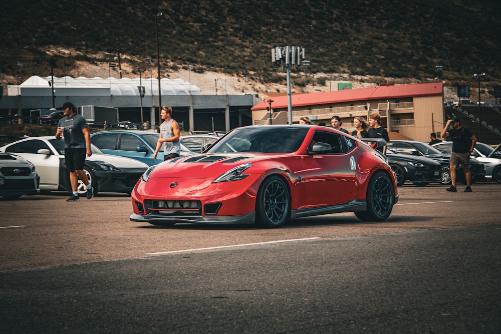 a red sports car parked in a parking lot