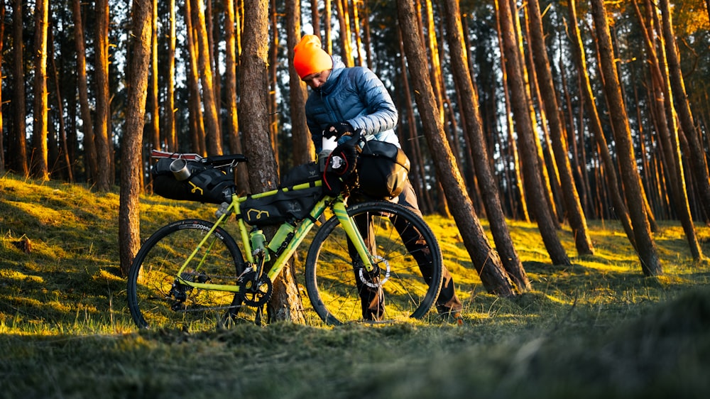 a person riding a bike through a forest