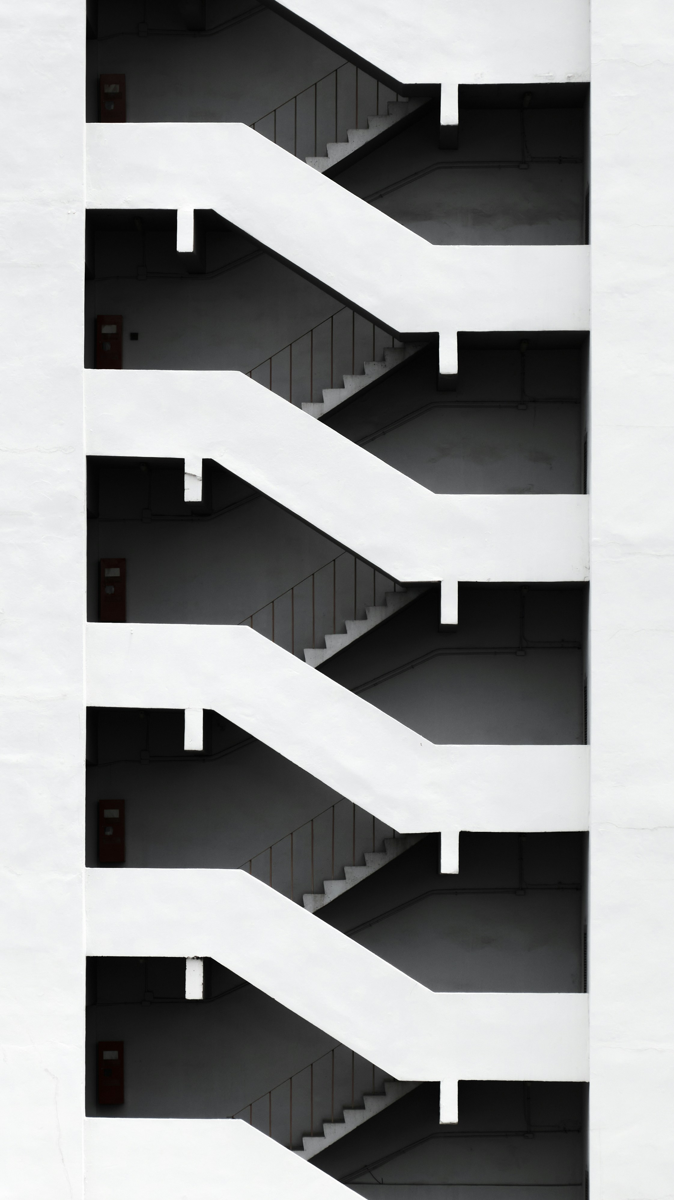 a black and white photo of a staircase in a building