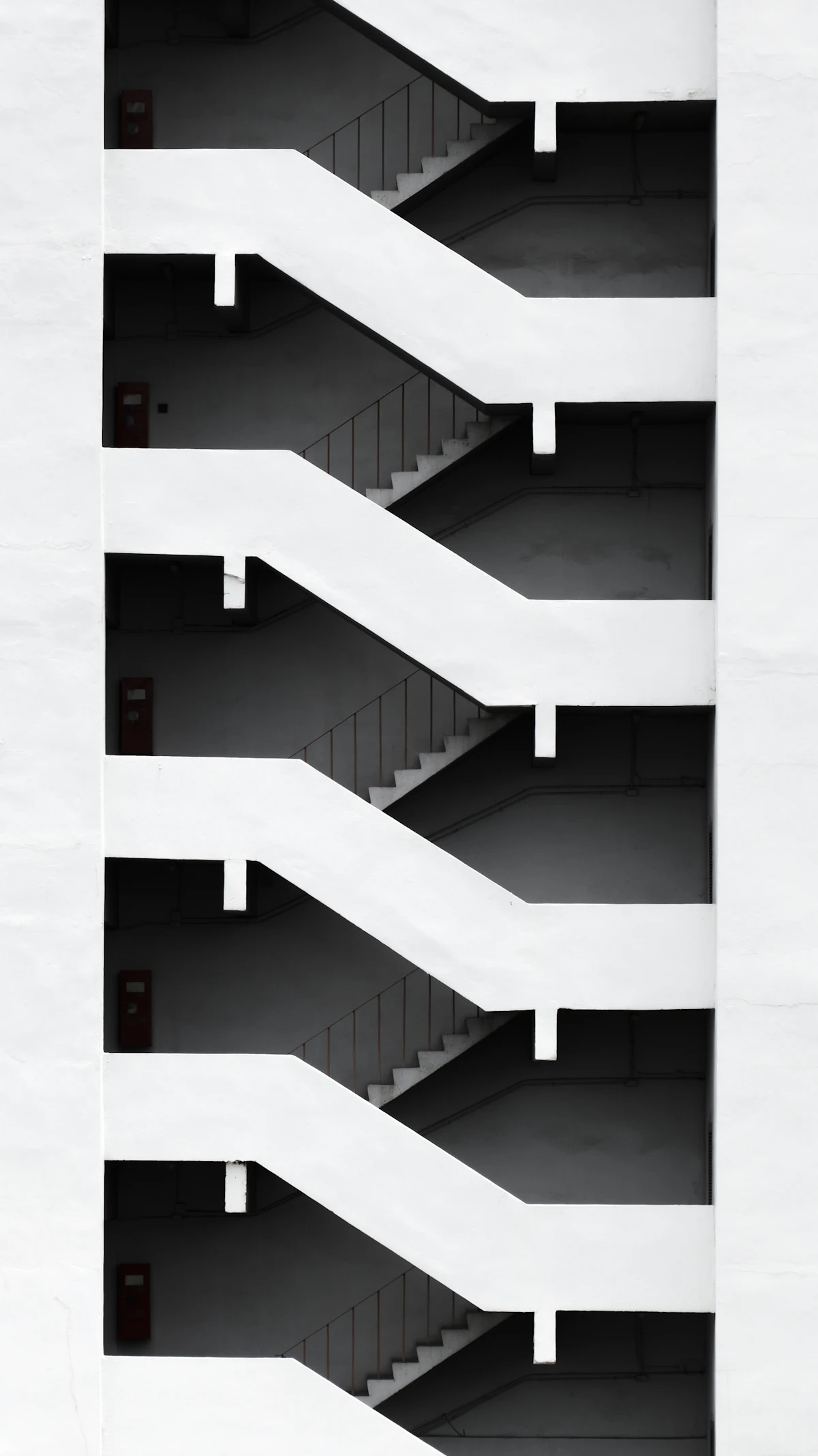 Looking up a staircase in a building, each level receding upward