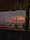 Sunset view of Shiralea Resort with divers preparing gear on the beach.