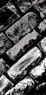 Close-up of textured brushstrokes revealing the intricate play of light and shadow in a Luberon village scene.