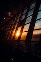 A panoramic view of the qstar office building at sunset, lights glowing warmly inside.